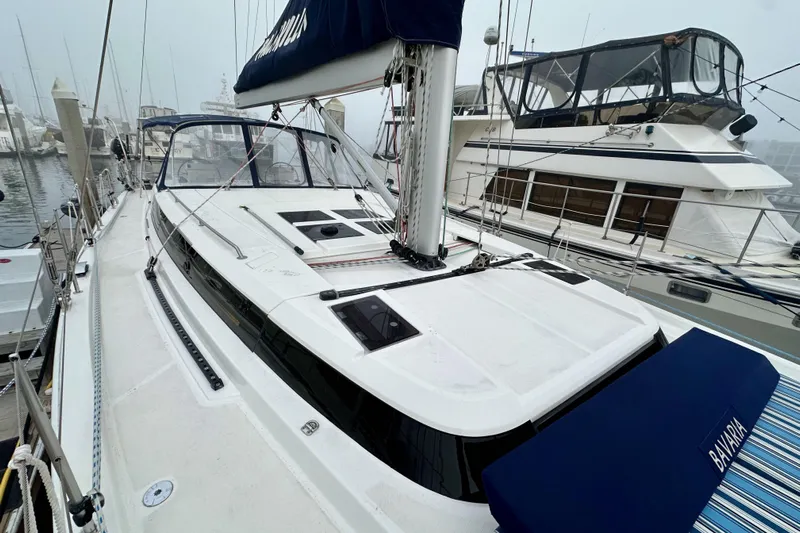 Pain Killer Yacht Photos Pics 2020 Bavaria C50 sailboat docked at marina, featuring sleek design and modern amenities.