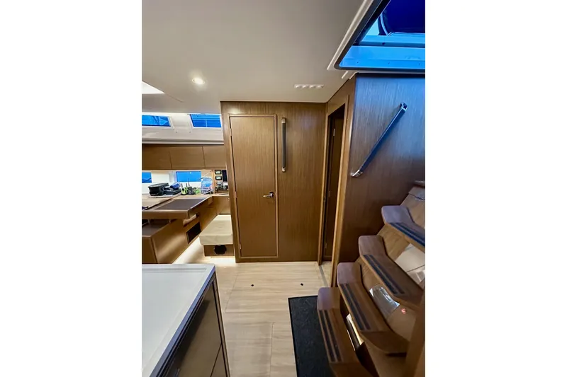 Pain Killer Yacht Photos Pics Interior of 2020 Bavaria C50 yacht with modern wood finish and sleek design.