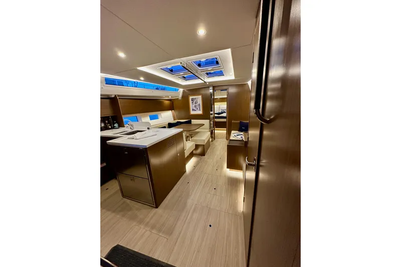 Pain Killer Yacht Photos Pics Luxurious interior of 2020 Bavaria C50 yacht with modern design and ambient lighting.