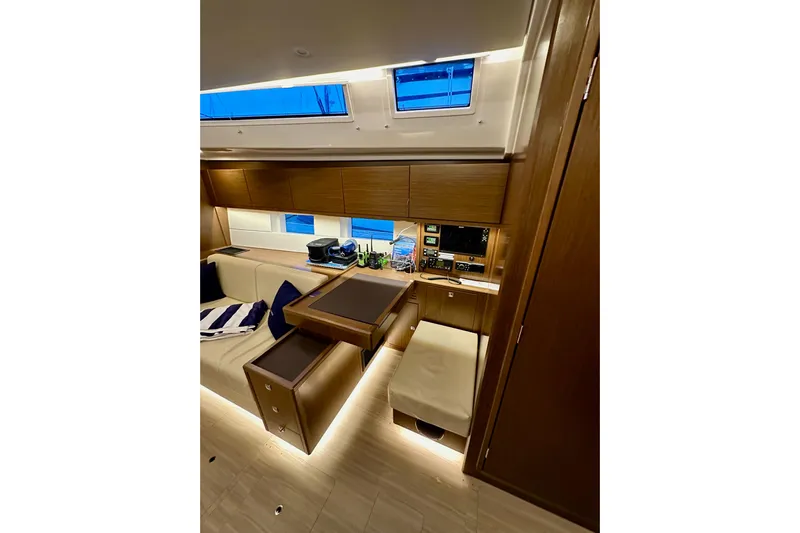 Pain Killer Yacht Photos Pics Luxurious interior of 2020 Bavaria C50 yacht with modern wood finish and seating area.