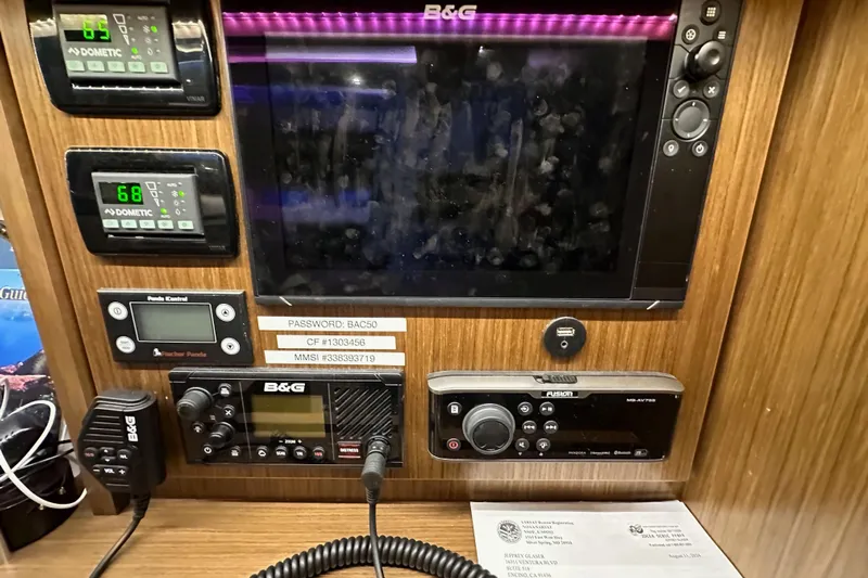 Pain Killer Yacht Photos Pics Control panel of a 2020 Bavaria C50 yacht with navigation and communication equipment.
