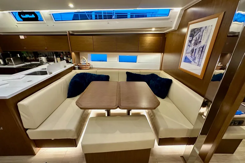 Pain Killer Yacht Photos Pics Luxurious interior of 2020 Bavaria C50 yacht with elegant seating and modern decor.