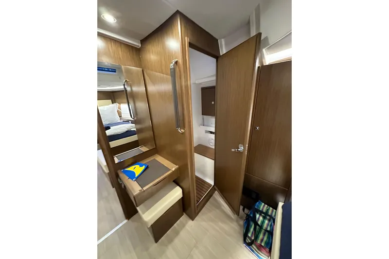 Pain Killer Yacht Photos Pics Interior of 2020 Bavaria C50 yacht with wooden finish and cozy cabin space.