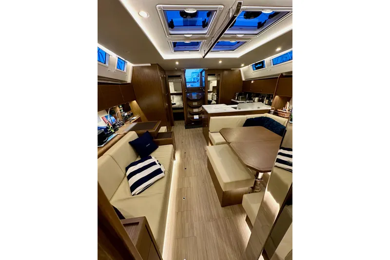 Pain Killer Yacht Photos Pics Luxurious interior of 2020 Bavaria C50 yacht with modern furnishings and ambient lighting.