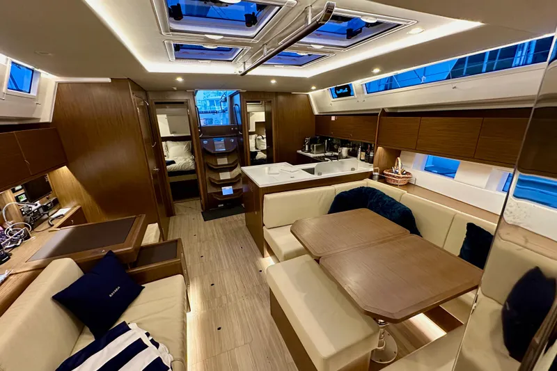 Pain Killer Yacht Photos Pics Luxurious interior of a 2020 Bavaria C50 yacht with modern furnishings and ample natural light.