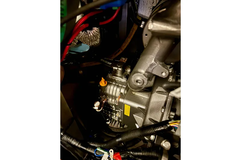 Pain Killer Yacht Photos Pics Engine compartment of a 2020 Bavaria C50 yacht, showcasing mechanical components and wiring.