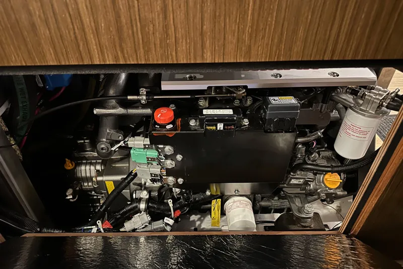 Pain Killer Yacht Photos Pics Engine compartment of a 2020 Bavaria C50 yacht, showcasing intricate mechanical components.