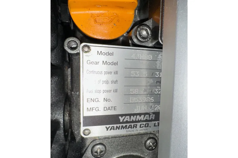 Pain Killer Yacht Photos Pics Engine plate of a Yanmar model, showing specifications and manufacturing details.