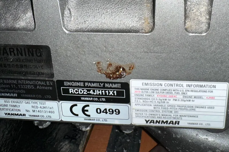 Pain Killer Yacht Photos Pics Engine label on a 2020 Bavaria C50, featuring Yanmar emission control information.