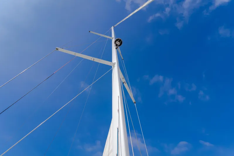 Joy Yacht Photos Pics Mast of 2023 Beneteau Oceanis Yacht 60 against a clear blue sky.