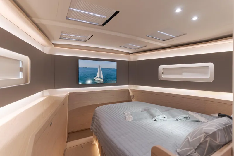 Joy Yacht Photos Pics Luxurious interior of 2023 Beneteau Oceanis Yacht 60 cabin with modern design and ambient lighting.