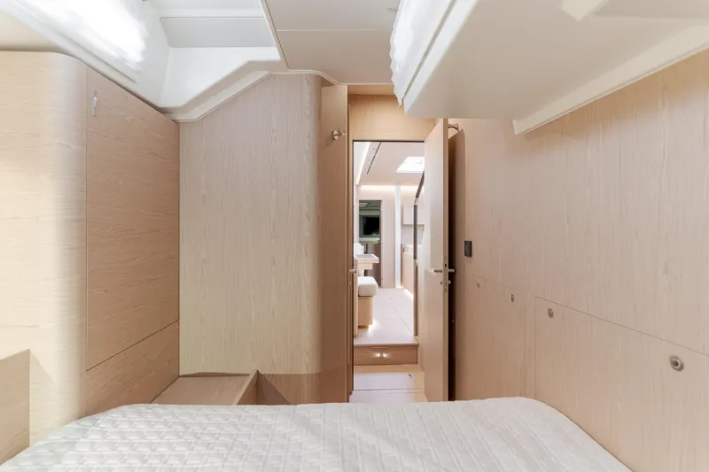 Joy Yacht Photos Pics Luxurious interior of 2023 Beneteau Oceanis Yacht 60, featuring modern wood finishes and elegant design.