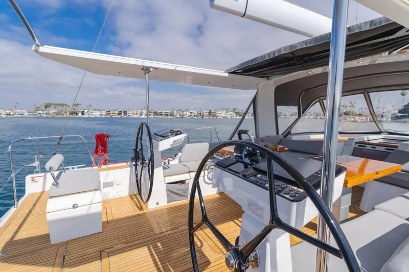 Joy Yacht Photos Pics 2023 Beneteau Oceanis Yacht 60 cockpit with dual steering wheels and modern design.