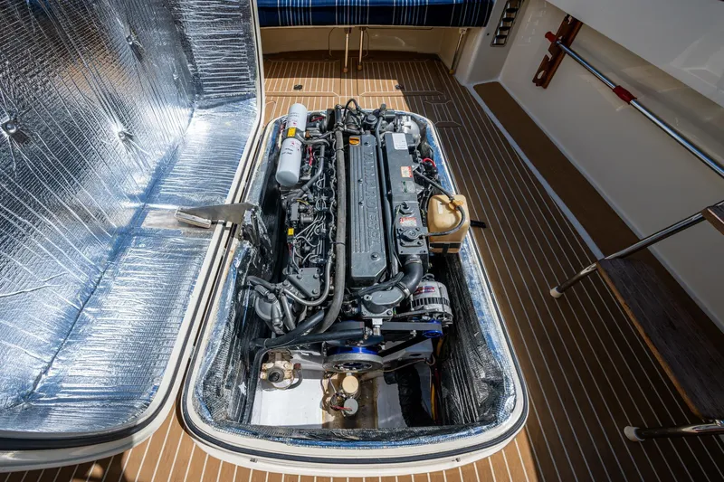 Summer Bliss Yacht Photos Pics Engine compartment of a 2001 Hinckley Picnic Boat Classic, showcasing detailed mechanics.