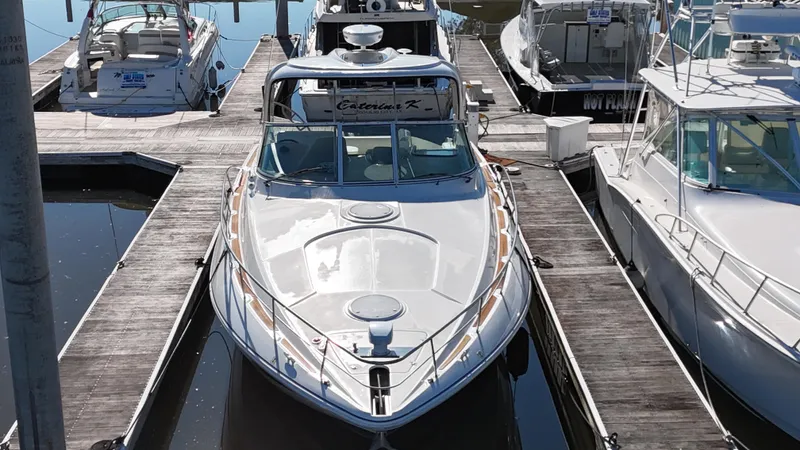 Cinta Yacht Photos Pics 2007 Cruisers Yachts 420 Express docked at marina, front view.