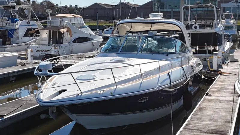 Cinta Yacht Photos Pics 2007 Cruisers Yachts 420 Express docked at a marina.