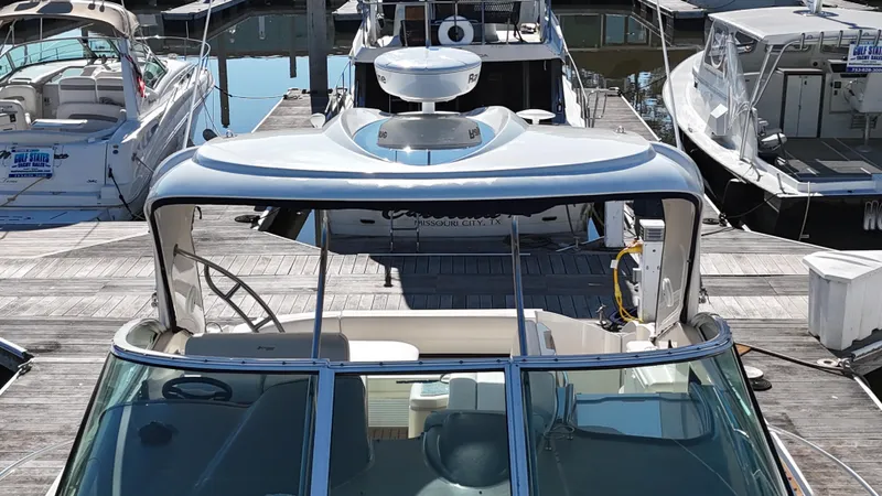 Cinta Yacht Photos Pics 2007 Cruisers Yachts 420 Express docked at a marina.