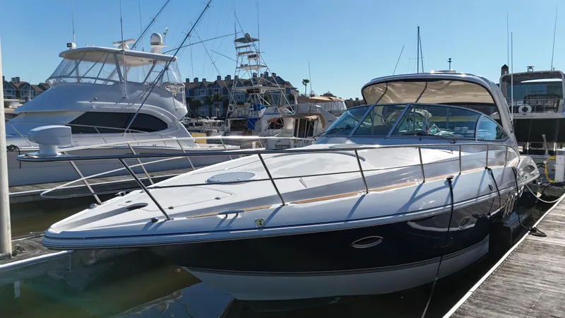 Cinta Yacht Photos Pics 2007 Cruisers Yachts 420 Express docked at a marina on a sunny day.
