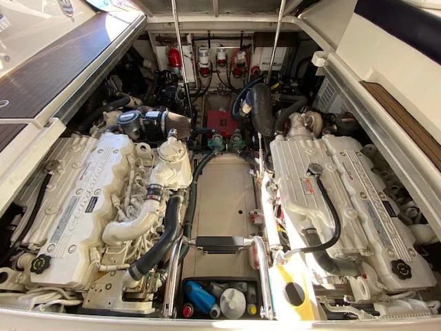 Day Dreamer Yacht Photos Pics Engine compartment of a 2010 Sea Ray 450 Sundancer, showcasing dual engines and mechanical components.