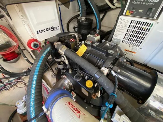 Day Dreamer Yacht Photos Pics Engine room of 2010 Sea Ray 450 Sundancer with marine generator and machinery.