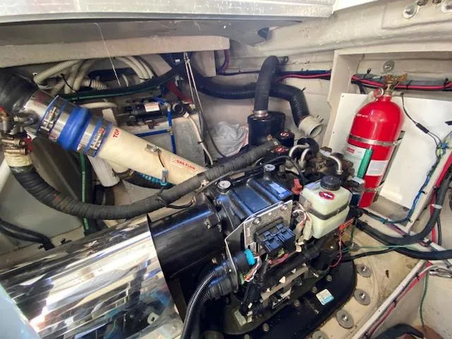 Day Dreamer Yacht Photos Pics Engine room of 2010 Sea Ray 450 Sundancer with visible fire extinguisher and mechanical components.