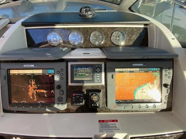 Day Dreamer Yacht Photos Pics Dashboard of 2010 Sea Ray 450 Sundancer with navigation screens and gauges.