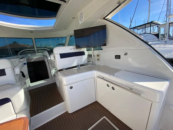 Day Dreamer Yacht Photos Pics Luxurious interior of 2010 Sea Ray 450 Sundancer yacht with seating and entertainment area.