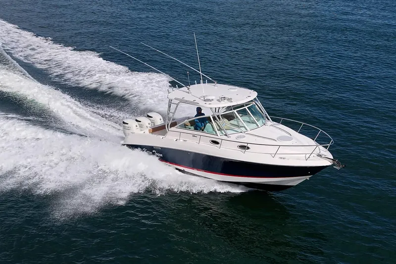  Yacht Photos Pics 2013 Wellcraft 340 Coastal boat cruising on open water.