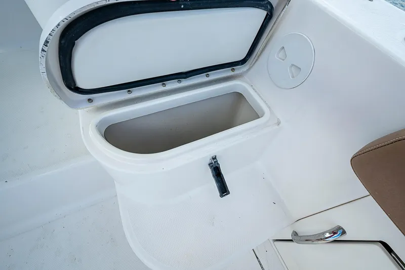  Yacht Photos Pics 2013 Wellcraft 340 Coastal boat storage compartment with open lid and handle.