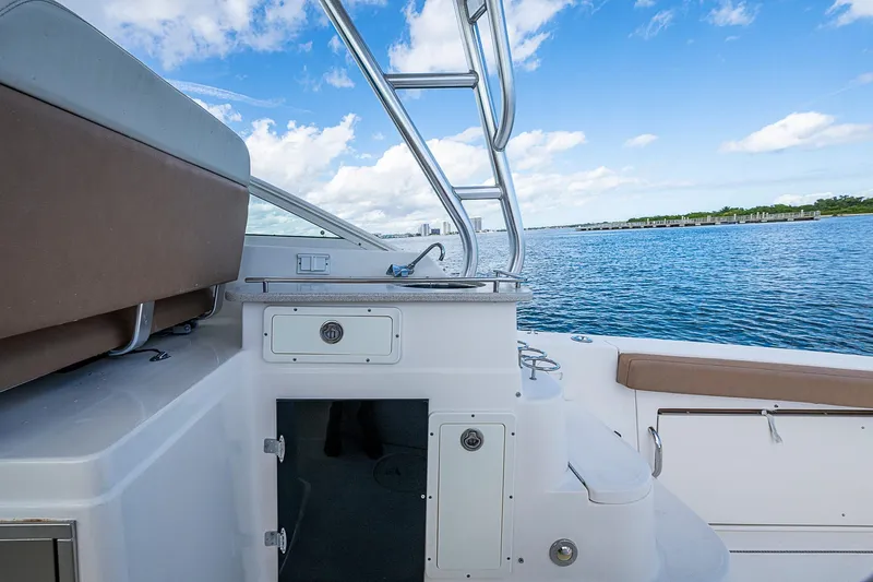  Yacht Photos Pics 2013 Wellcraft 340 Coastal boat interior with ocean view and clear blue sky.