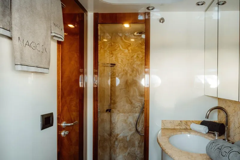  Yacht Photos Pics Luxurious bathroom in 2004 Astondoa 82 GLX yacht with marble accents and elegant fixtures.