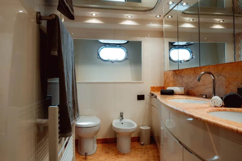  Yacht Photos Pics Luxurious bathroom in 2004 Astondoa 82 GLX yacht with elegant fixtures and marble countertop.