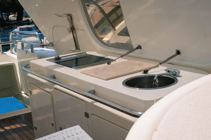  Yacht Photos Pics Outdoor kitchen on 2004 Astondoa 82 GLX yacht with sink and grill.