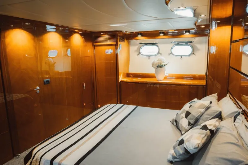  Yacht Photos Pics Luxurious cabin interior of 2004 Astondoa 82 GLX yacht with elegant wood finish.