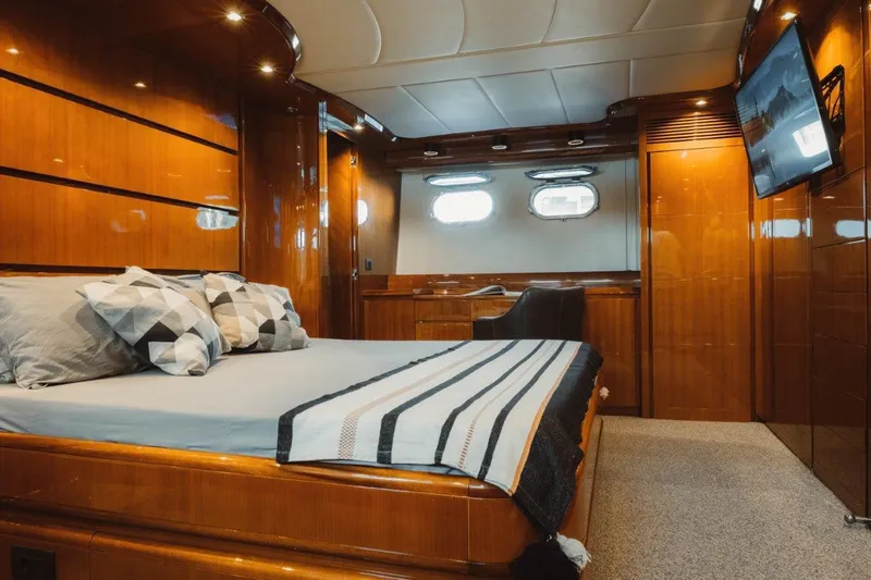  Yacht Photos Pics Luxurious cabin interior of 2004 Astondoa 82 GLX yacht with elegant wood finishes.