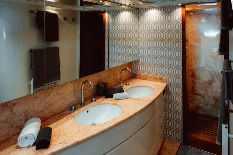  Yacht Photos Pics Luxurious bathroom in 2004 Astondoa 82 GLX yacht with dual sinks and elegant design.