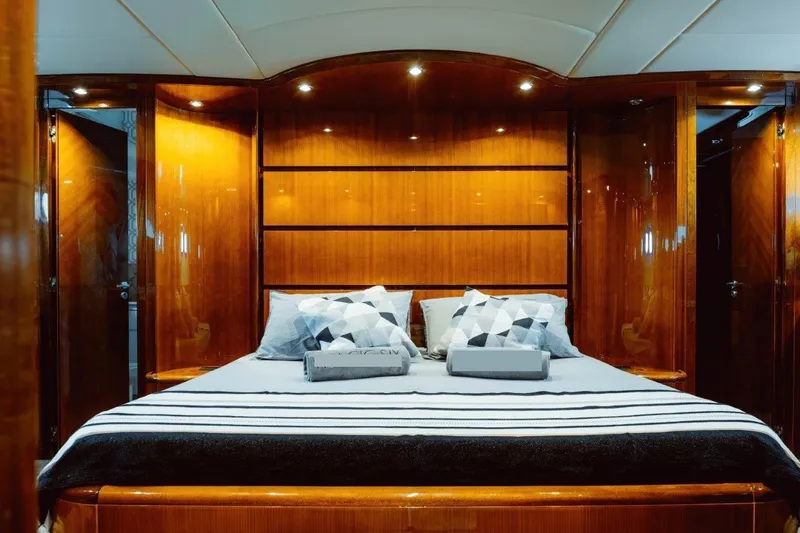  Yacht Photos Pics Luxurious bedroom interior on 2004 Astondoa 82 GLX yacht with elegant wood finish.