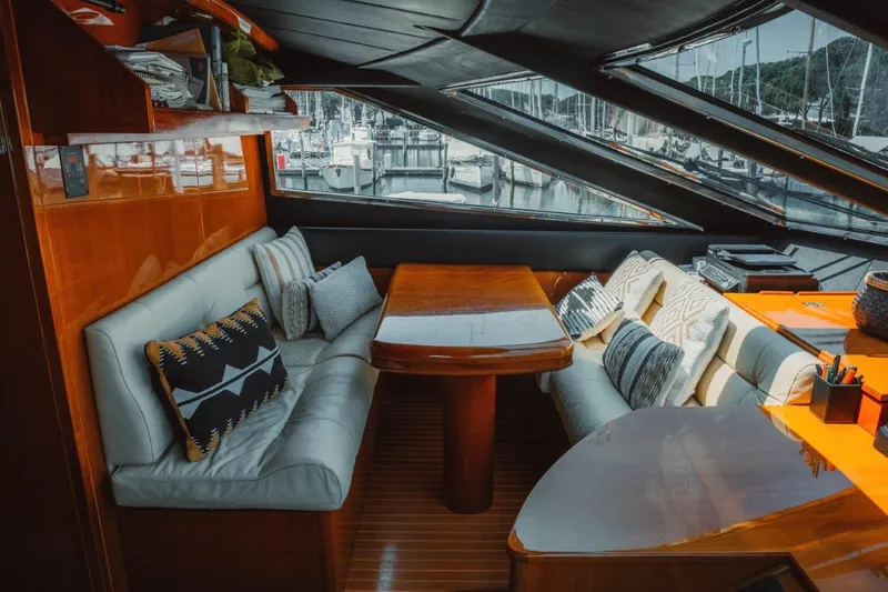  Yacht Photos Pics Luxurious interior of 2004 Astondoa 82 GLX yacht with elegant seating and wooden table.