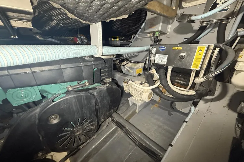 Tom's Cruise Yacht Photos Pics Engine room of 2016 Cranchi M 44 HT yacht, showcasing mechanical components and wiring.