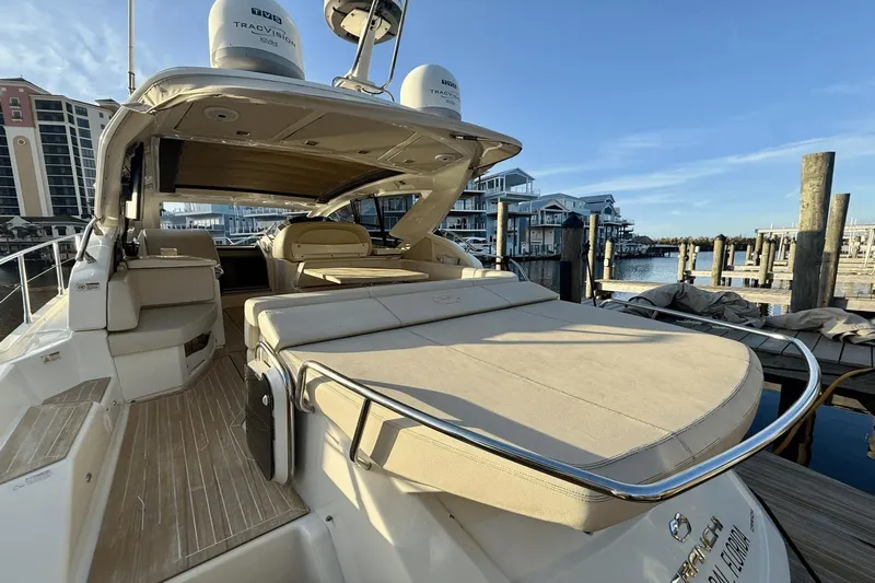 Tom's Cruise Yacht Photos Pics 2016 Cranchi M 44 HT yacht docked, featuring spacious deck and luxurious seating.