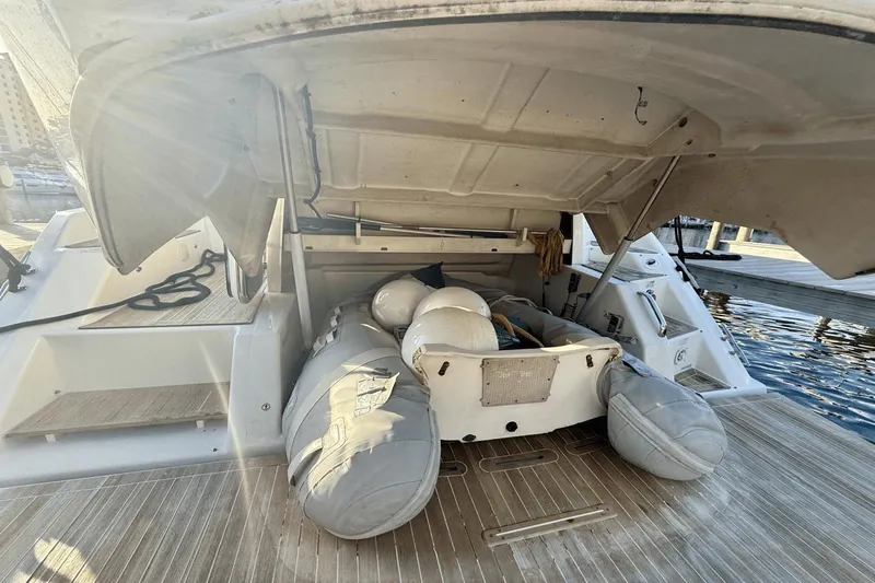 Tom's Cruise Yacht Photos Pics 2016 Cranchi M 44 HT yacht with open storage compartment and inflatable dinghy.