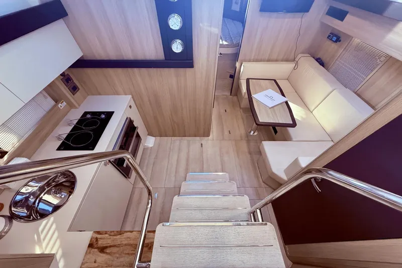 Tom's Cruise Yacht Photos Pics Interior of 2016 Cranchi M 44 HT yacht with modern kitchen and cozy seating area.