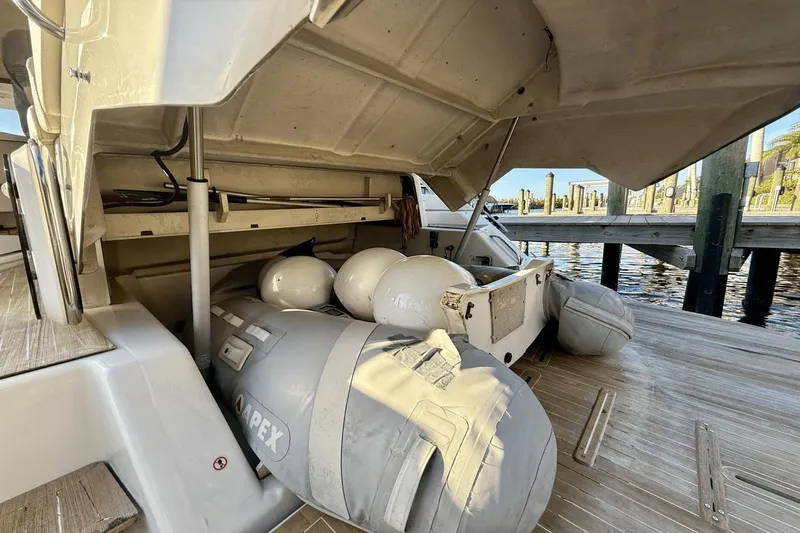 Tom's Cruise Yacht Photos Pics 2016 Cranchi M 44 HT yacht with open storage compartment and inflatable boat.