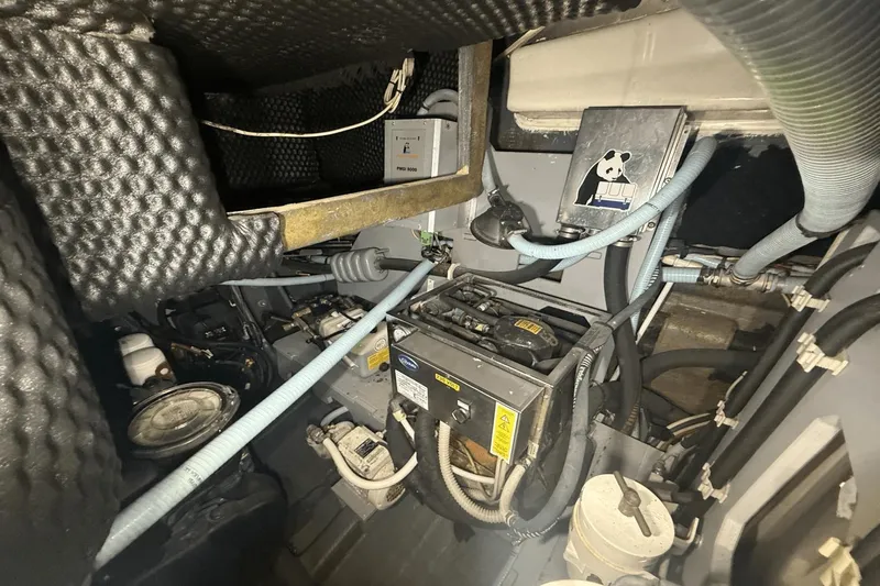 Tom's Cruise Yacht Photos Pics Engine room of 2016 Cranchi M 44 HT yacht with various mechanical components.