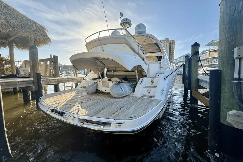 Tom's Cruise Yacht Photos Pics 2016 Cranchi M 44 HT yacht docked at marina, rear view.