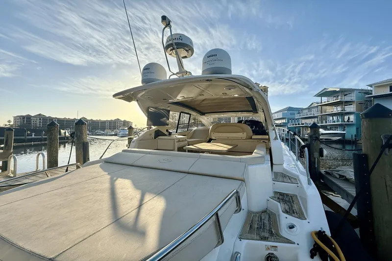 Tom's Cruise Yacht Photos Pics 2016 Cranchi M 44 HT yacht docked at marina, showcasing luxurious deck and seating.