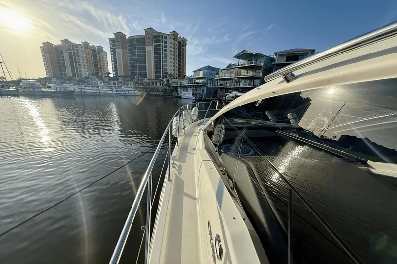 Tom's Cruise Yacht Photos Pics 2016 Cranchi M 44 HT yacht docked in marina with cityscape background.