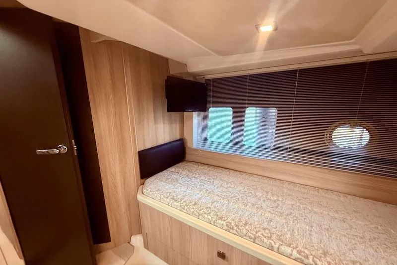 Tom's Cruise Yacht Photos Pics Interior cabin of 2016 Cranchi M 44 HT yacht with bed and window blinds.