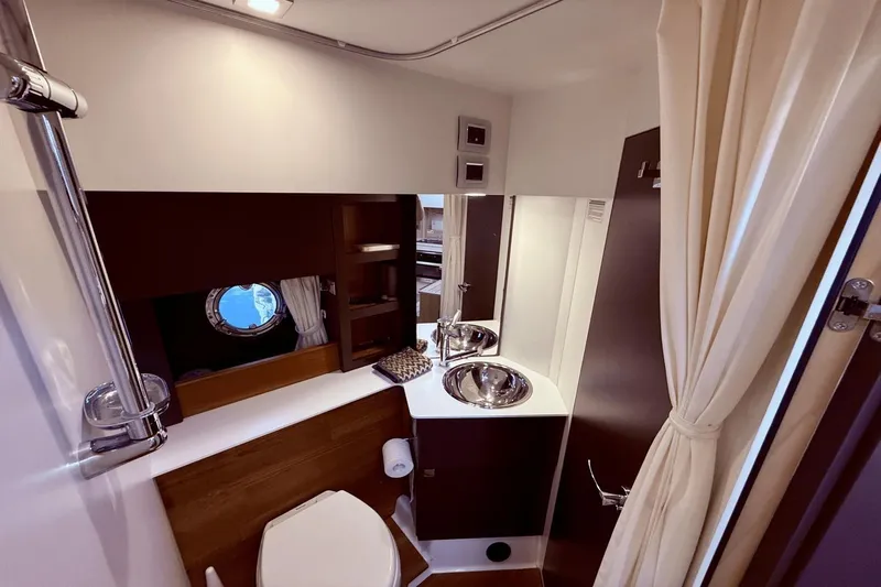 Tom's Cruise Yacht Photos Pics Luxurious bathroom interior of 2016 Cranchi M 44 HT yacht with modern fixtures.