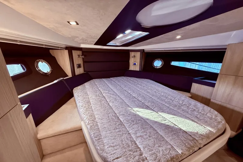 Tom's Cruise Yacht Photos Pics Luxurious interior cabin of 2016 Cranchi M 44 HT yacht with elegant bedding.